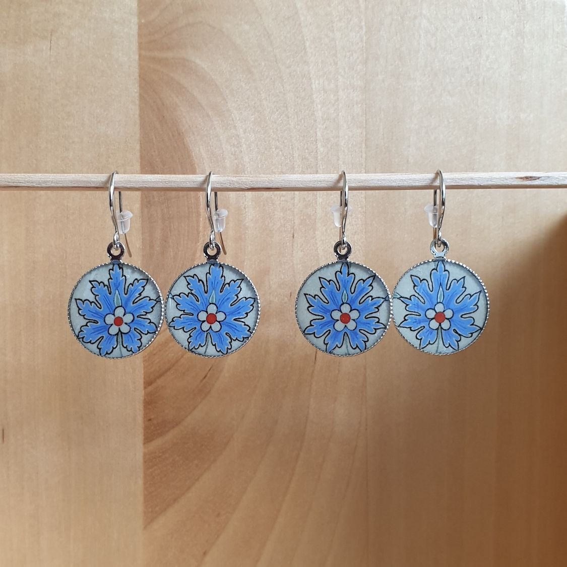 Blue oriental flower pendant earrings