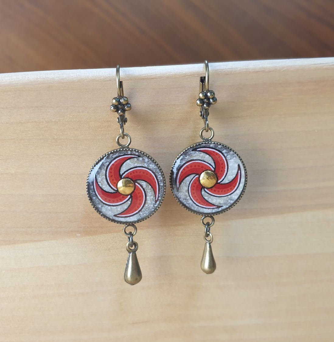 Red spiral dangling earrings