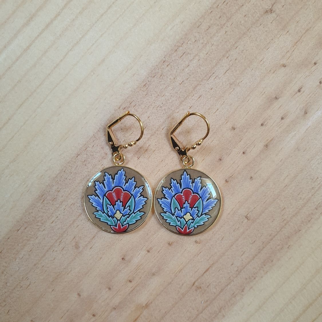 Blue oriental flower pendant earrings