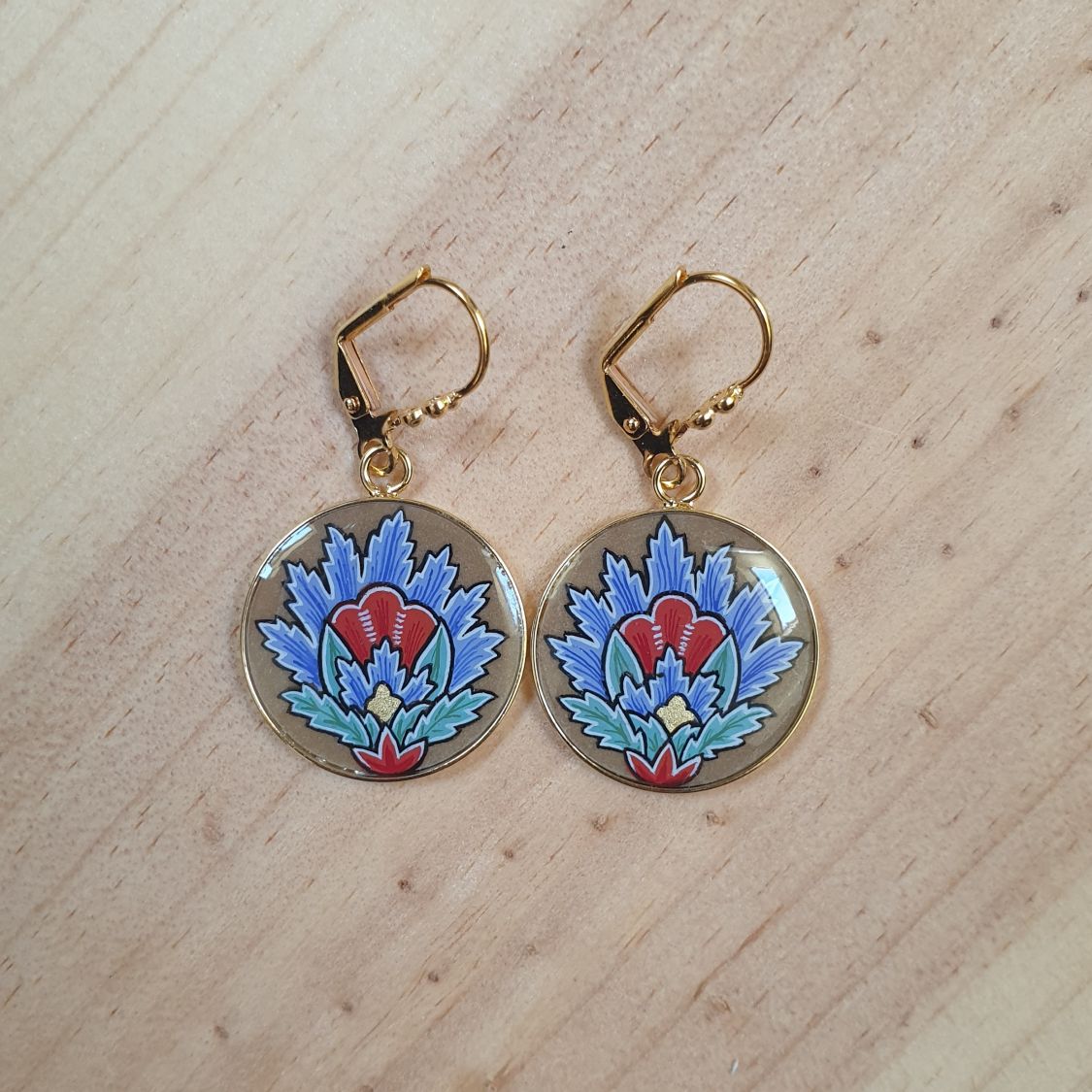 Blue oriental flower pendant earrings