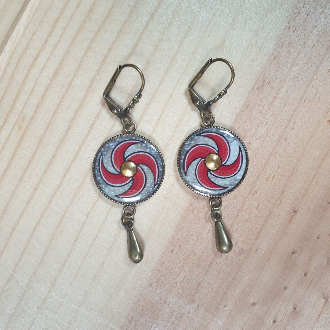 Red spiral dangling earrings