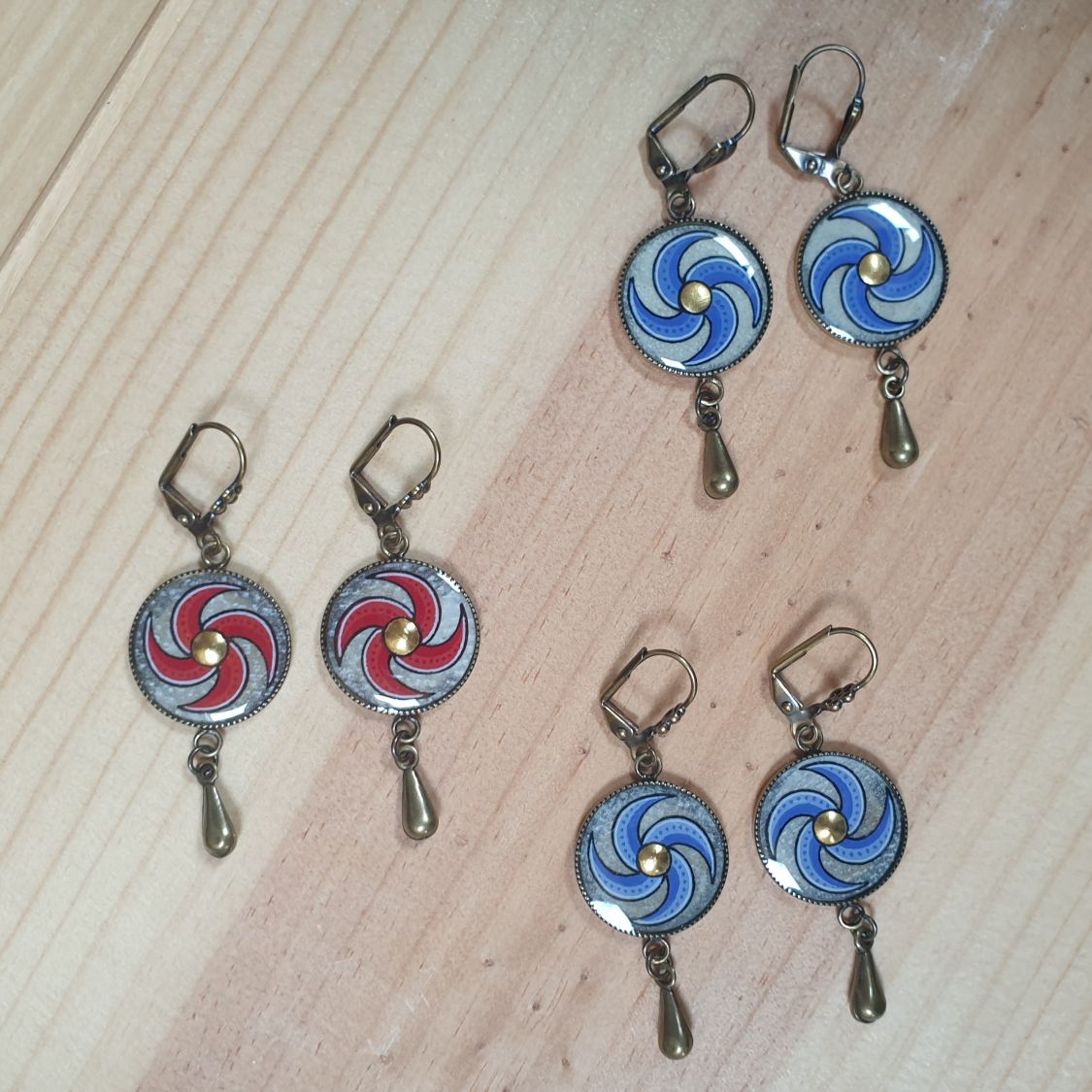 Red spiral dangling earrings