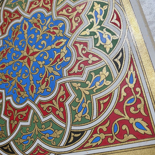 Gold/green/blue/red arabesque illumination 