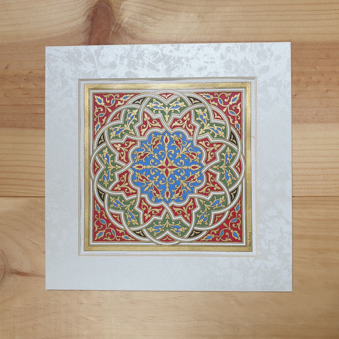 Gold/green/blue/red arabesque illumination 