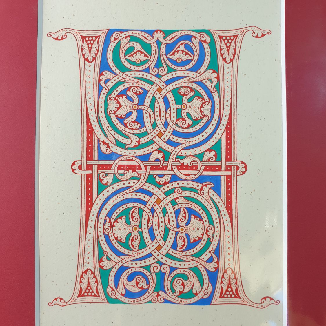 Illuminated letter H in Romanesque style