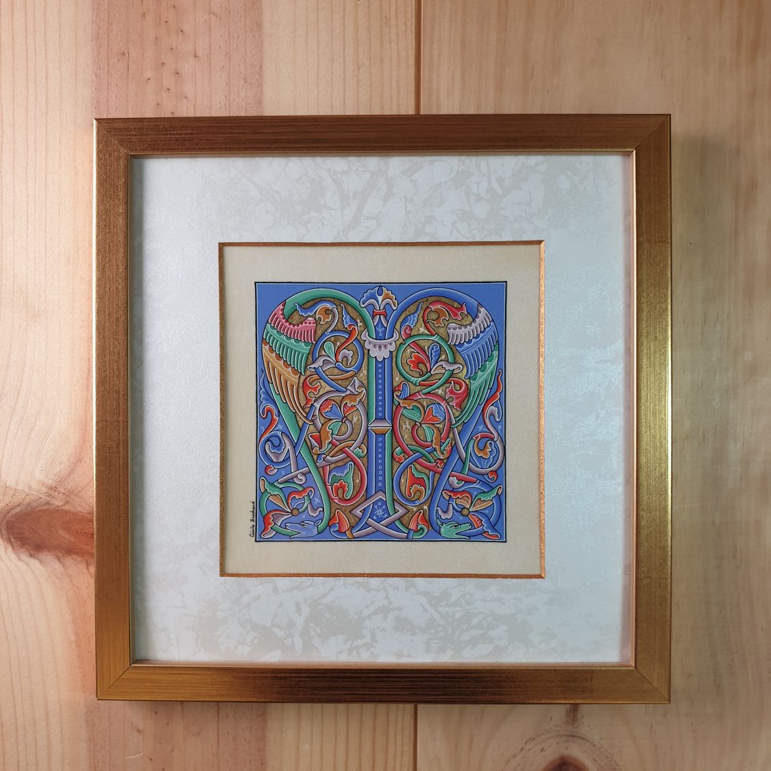 Illuminated roman style letter M framed