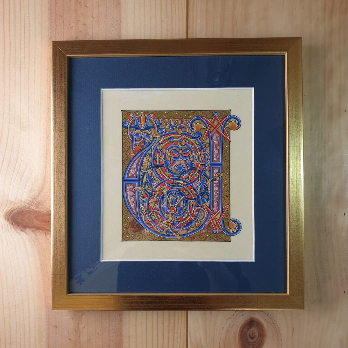 Illuminated roman style letter U framed