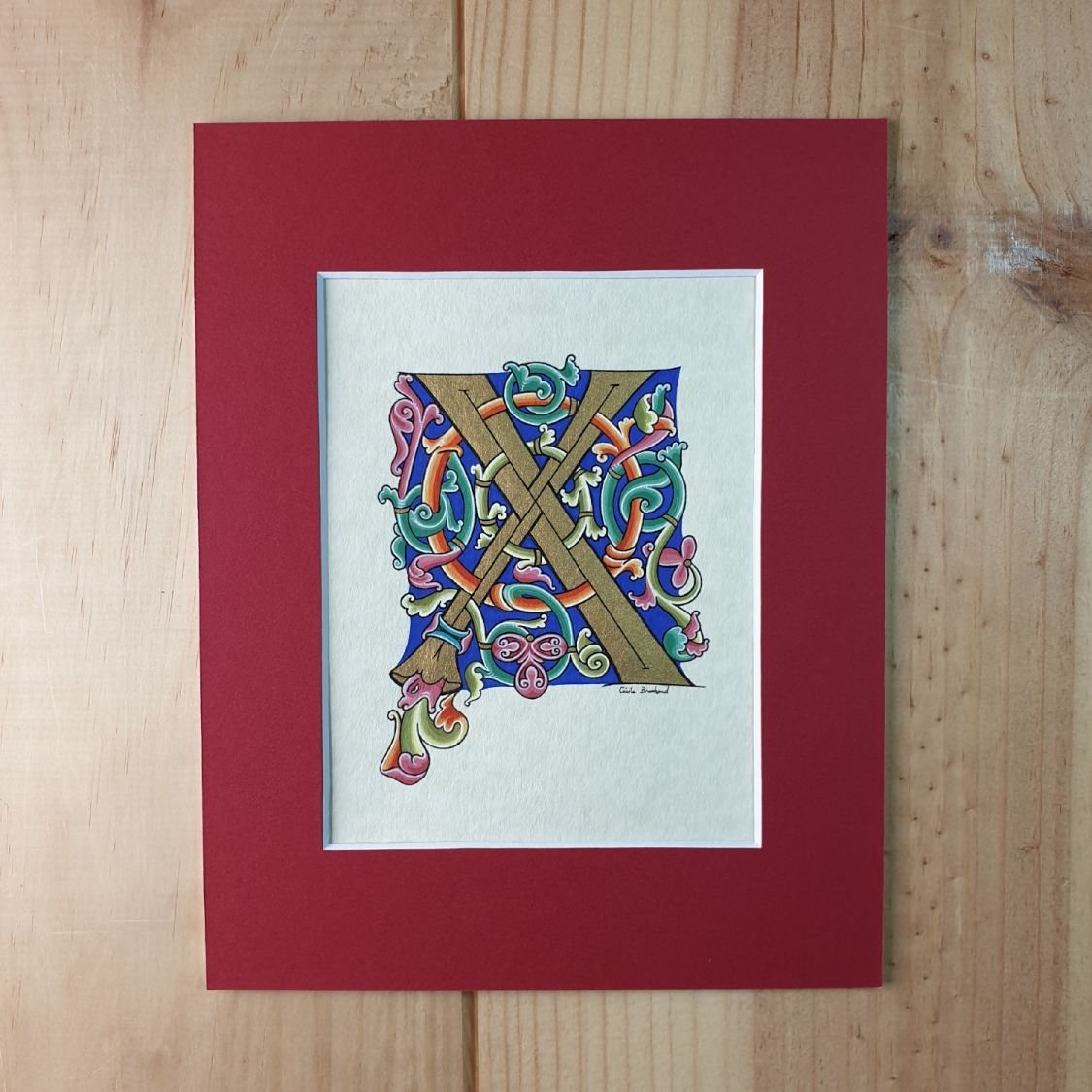 Romanesque illuminated letter X