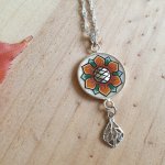 Necklace pendant illuminated spring flower orange / white on silver chain