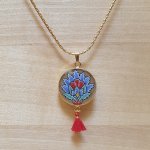 Necklace pendant illuminated blue oriental flower