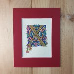 Romanesque illuminated letter X