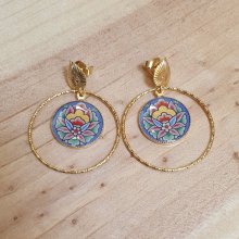 Oriental flower earrings with blue background